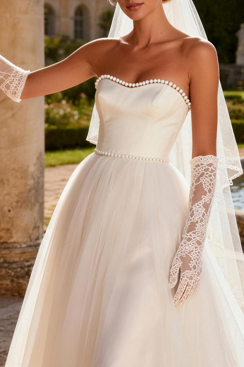 Ivory Tulle Strapless A Line Beaded Sweep Train Wedding Dress