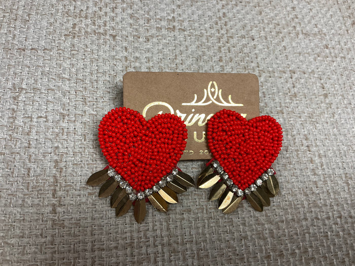 Camel Threads Shield My Heart earrings featuring delicate heart-shaped and shield design in silver metal.
