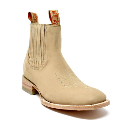 Beige boot with brand label on a white background
