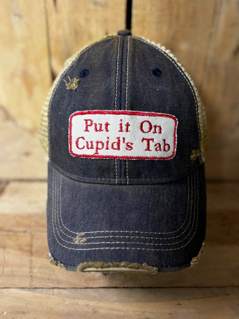 Put it on Cupid's Tab-distressed Trucker Hat