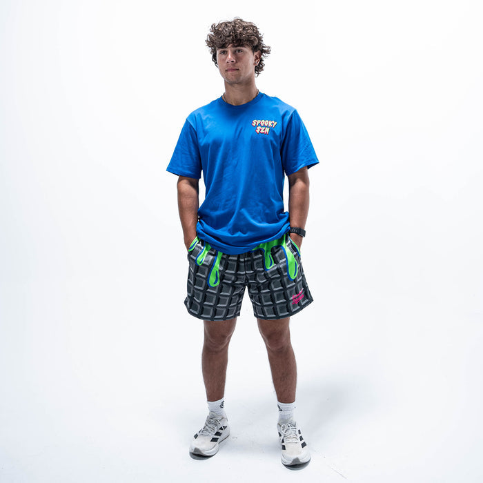 Adult model wearing blue graphic tee with "Spooky SZN Waffle" design