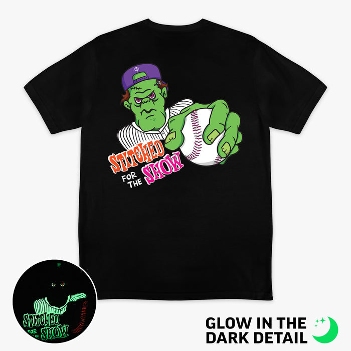 Black graphic tee with glow-in-the-dark "Stitched For The Show" detail